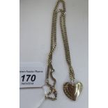 A Tiffany & Co Sterling silver coloured metal double heart shaped pendant, on a cut,