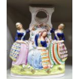 A mid 19thC Staffordshire pottery flatback watchstand, featuring Scots Lassies,