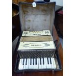 A Hohner Student 1 piano accordian bears the label of Still Reeds of Germany,