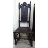 A mid 19thC floral and scroll carved oak framed high back side chair,