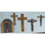 Five 20thC brass and other cast metal mounted wooden crucifix largest 14''h OS9