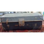 A late Victorian black canvas and hide trimmed trunk with flank carrying handles and a domed lid