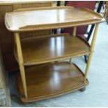 An Ercol light elm three tier tea trolley, on casters 30''h 27.