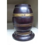 A late 19thC treen string box, in the form of a coppered two part barrel,