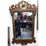 A 20thC Chippendale design mirror, set in a carved, moulded and fretworked,