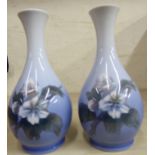 A pair of Royal Copenhagen porcelain vases of ovoid form with waisted necks and flared rims,