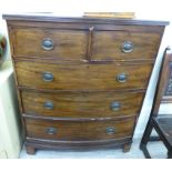 A late Victorian mahogany bow front dressing chest with two short/three long drawers,