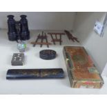A mixed lot: to include three similar miniature folding wooden easels and a Victorian black