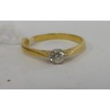 An 18ct gold diamond solitaire ring 11