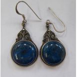 A pair of white metal earrings,