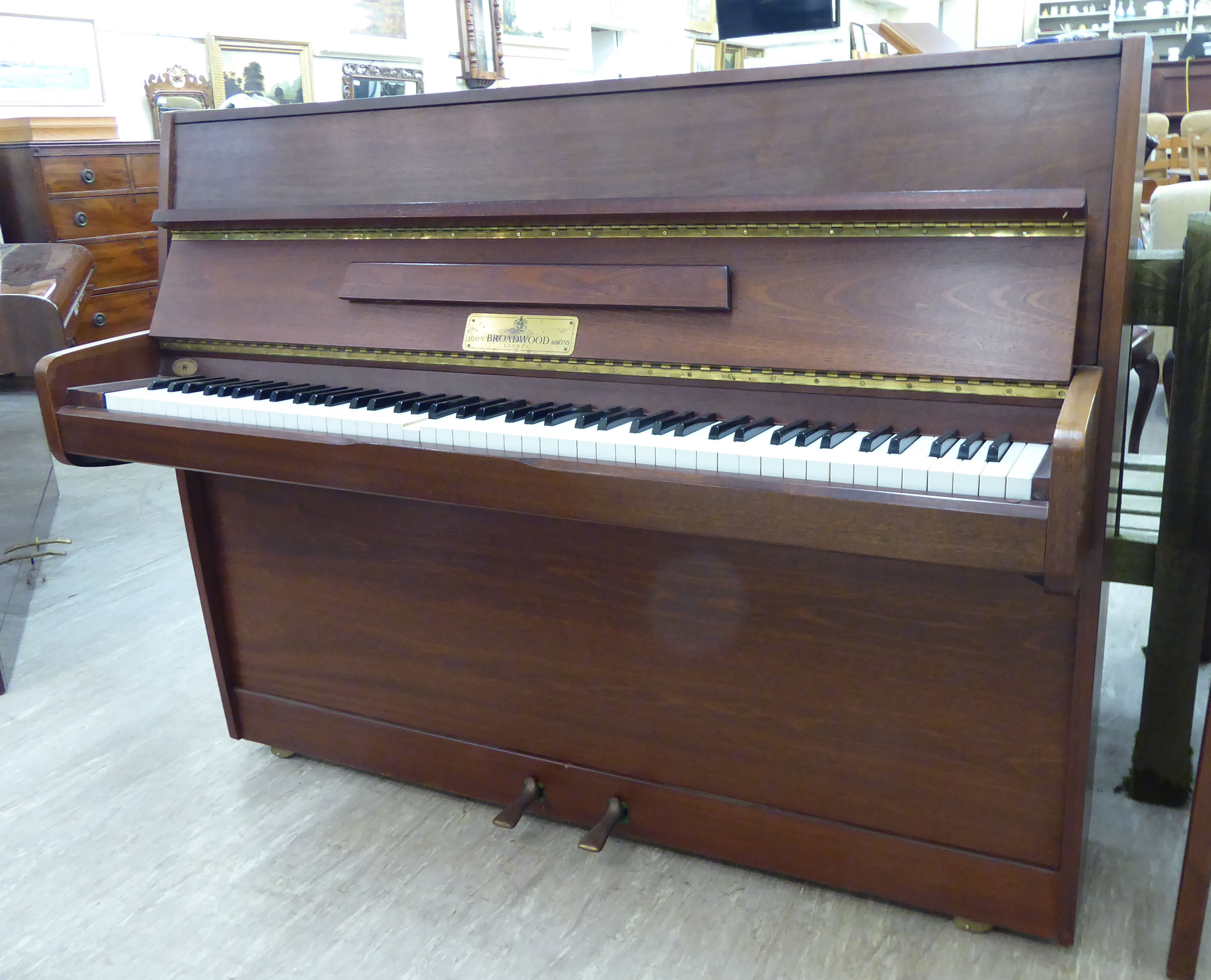 A John Broadwood & Sons teak cased upright piano with an overstrung iron frame, no.