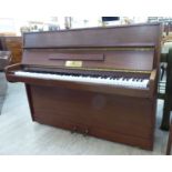 A John Broadwood & Sons teak cased upright piano with an overstrung iron frame, no.