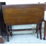An early 20thC mahogany Sutherland table, the top with canted corners,