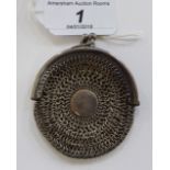 An early 20thC Continental silver coloured metal framed chain mail purse of circular form stamped