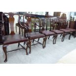 A set of four early 19thC style mahogany framed dining chairs with yoke crests and ribbon splats,