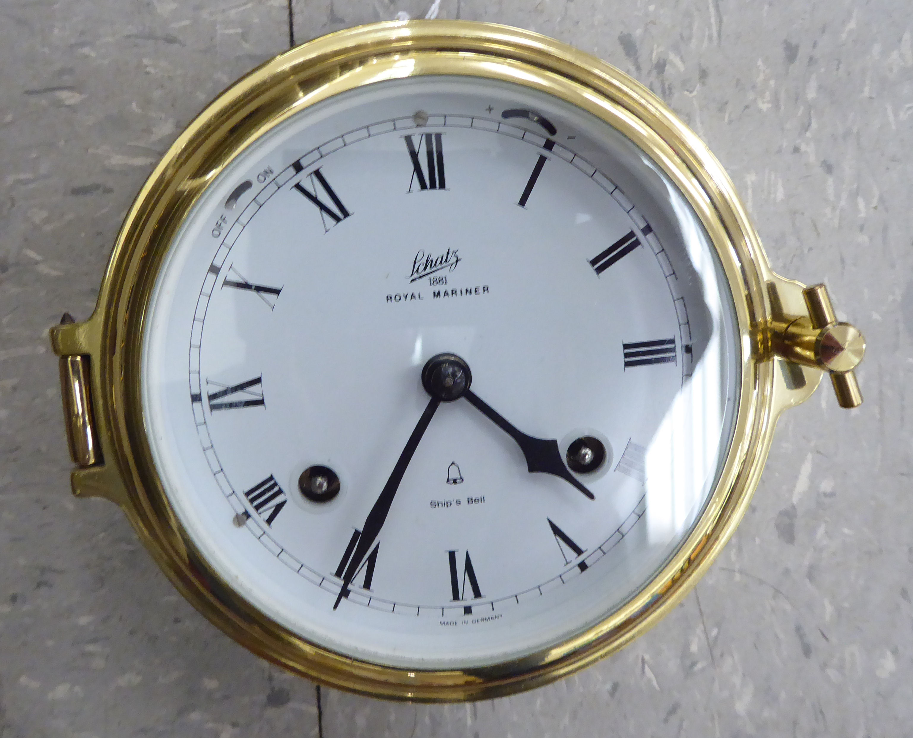 A modern Schatz 1881 Royal Mariner Ship's Bell lacquered brass cased bulkhead timepiece;