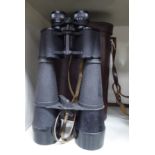 A pair of Telstar 45x70 binoculars in a buckled, moulded,