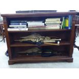 An early 20thC walnut open front dwarf bookcase,