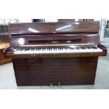 A Haegele mahogany cased upright piano with an overstrung iron frame, no.