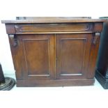 A late Victorian mahogany chiffonier base with a frieze drawer, over a pair of panelled doors,