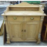 A late 19thC Continental pine washstand, the top surmounted by an upstand,