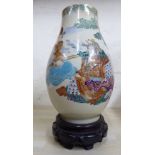 An early 20thC Satsuma earthenware vase of ovoid form,