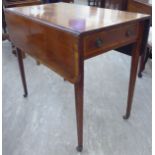 An early 19thC ebony string and crossbanded mahogany Pembroke table with an end drawer and a