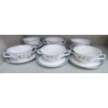 A set of six Midwinter china twin handled soup bowls and saucers,
