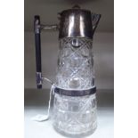 A late 19thC cylindrical cut glass claret jug with applied silver plated mounts,