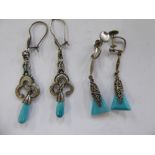 Two similar pairs of white metal earrings,