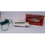 A 1960s Louis Marx Toys 'M1 Police Car' with a battery operated remote control in the original