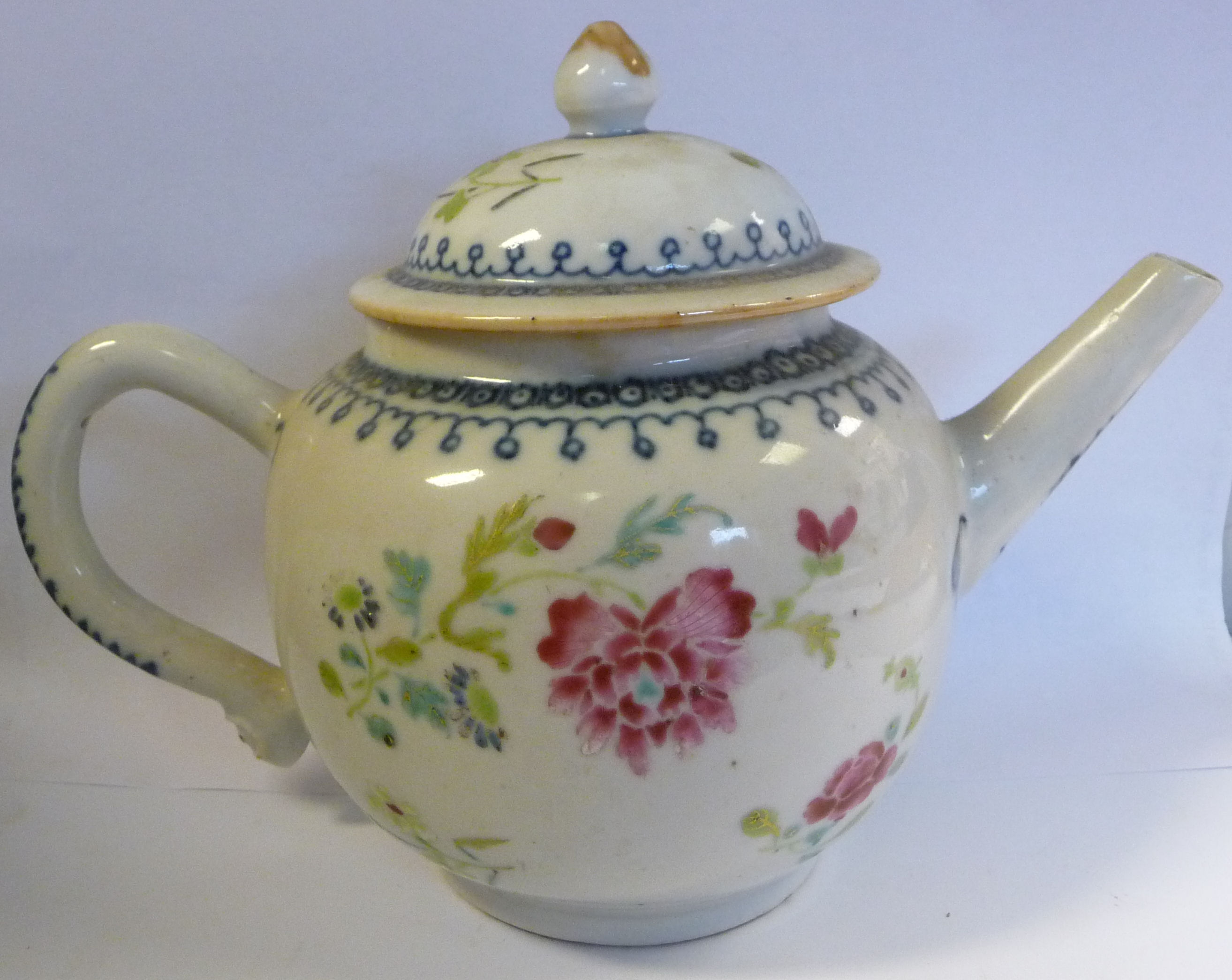 A late 18thC Chinese porcelain teapot of globular form with a domed and knop,