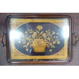 A late 19th/early 20thC mahogany framed twin handled tray,