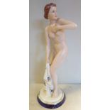 A 1930s Royal Dux Art Deco porcelain figure, designed by Elly Strombach, a standing nude,