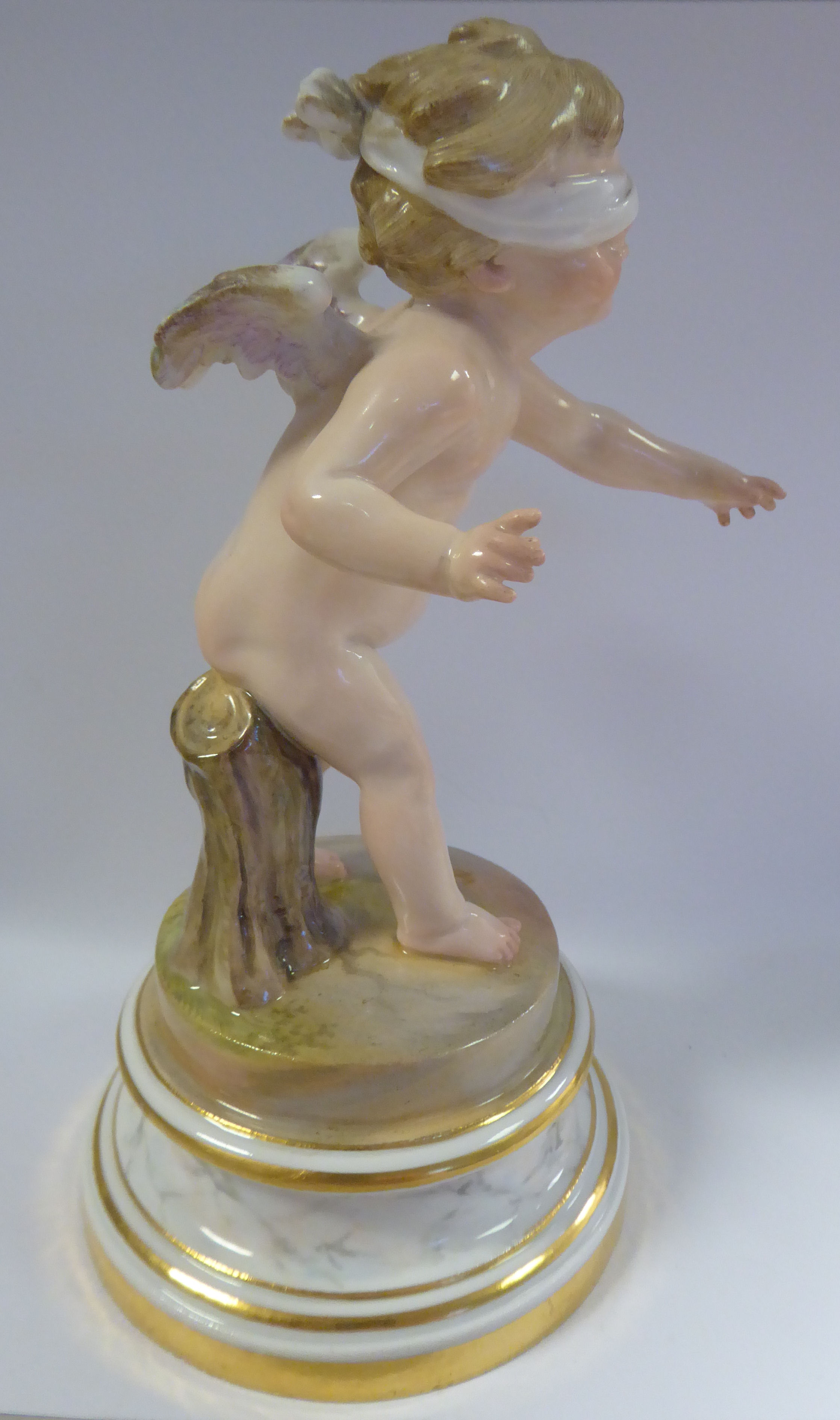 A Meissen porcelain figure 'Cupid Blindfolded' on a gilded, - Image 4 of 6
