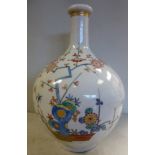 A late 19th/early 20thC Japanese porcelain bottle vase of ovoid form, the short,