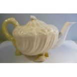 A Belleek cream coloured and tinted yellow lustre glazed,
