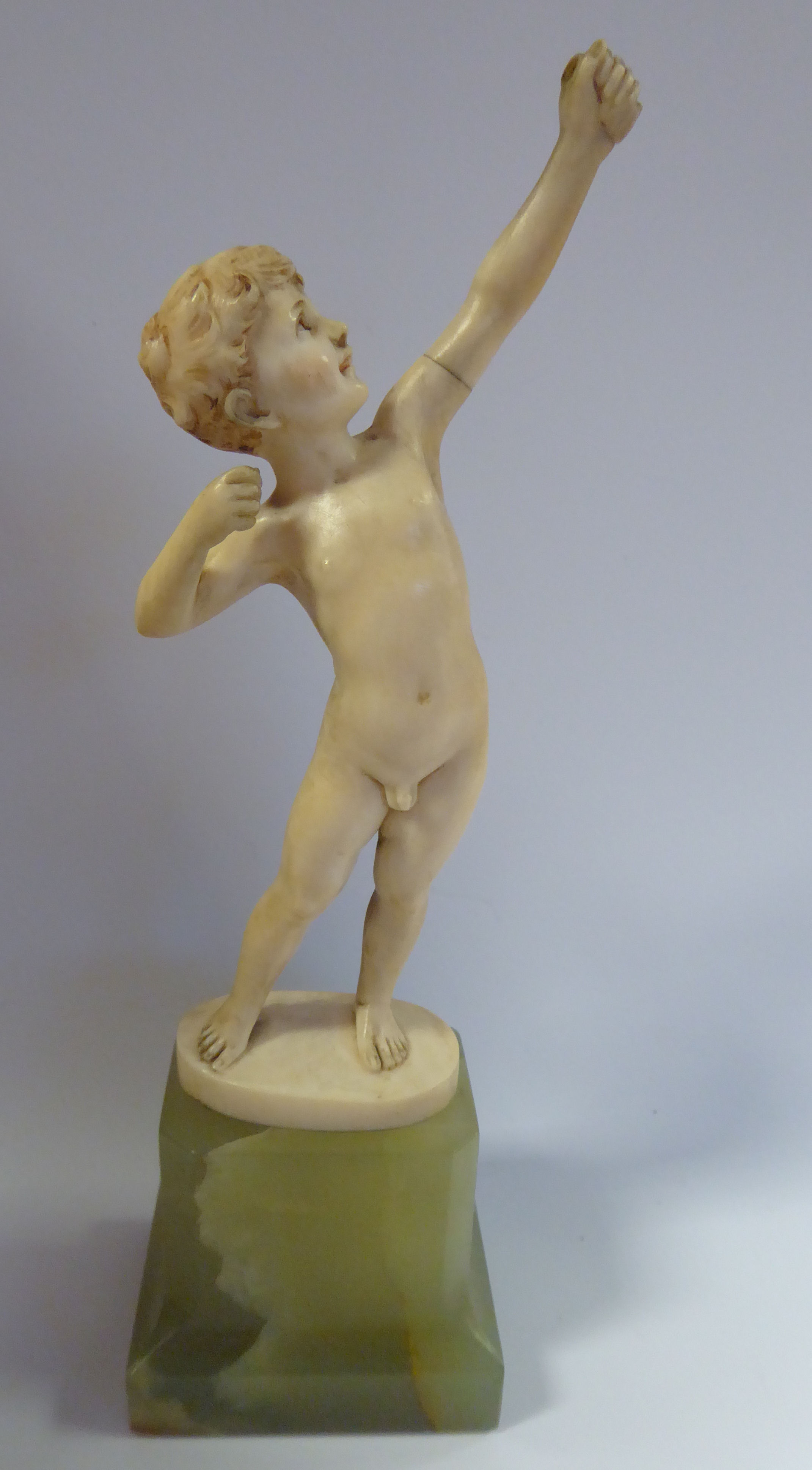 F Prieiss - 'The Archer' a carved ivory figure, (bow missing) bears a signature,