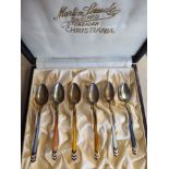 A set of six Art Deco inspired silver and individually coloured engine turned enamel coffee spoons