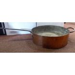 An early/mid 19thC copper shallow cooking pan with straight sides, a long,