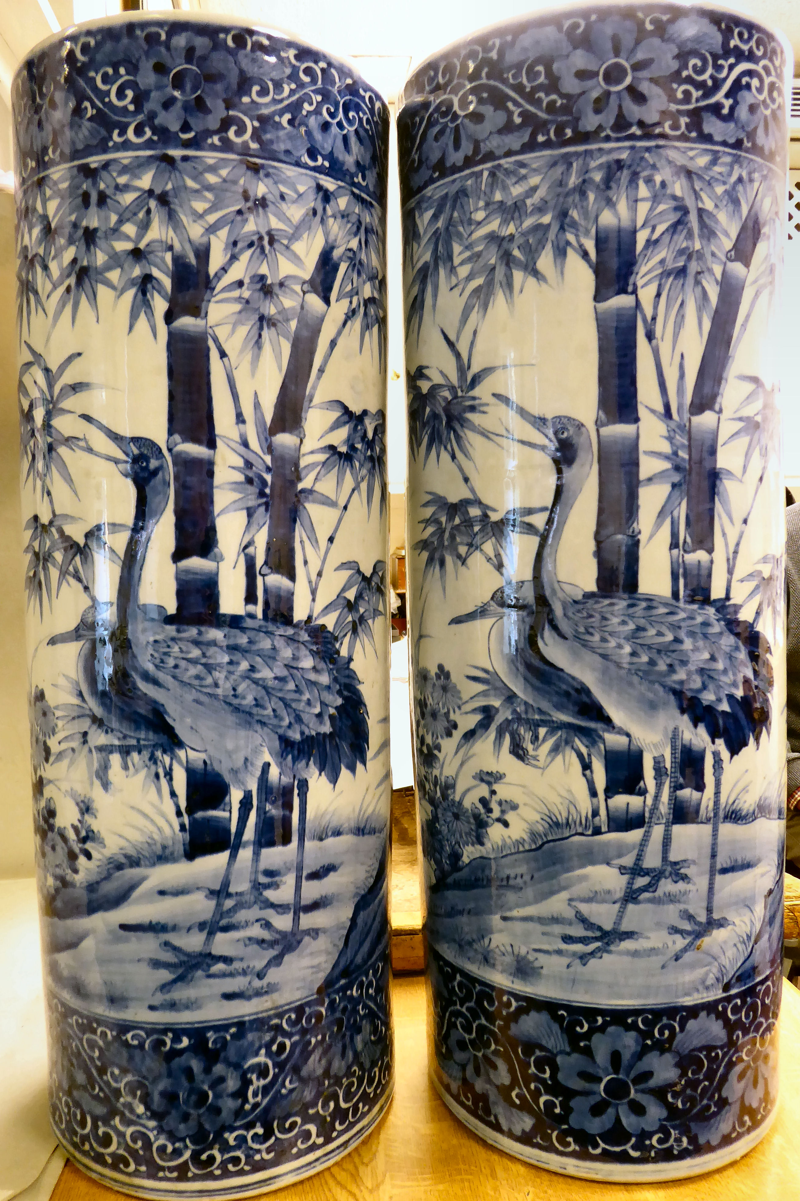 A pair of late 19thC Japanese porcelain cylindrical stickstands,