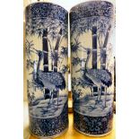 A pair of late 19thC Japanese porcelain cylindrical stickstands,