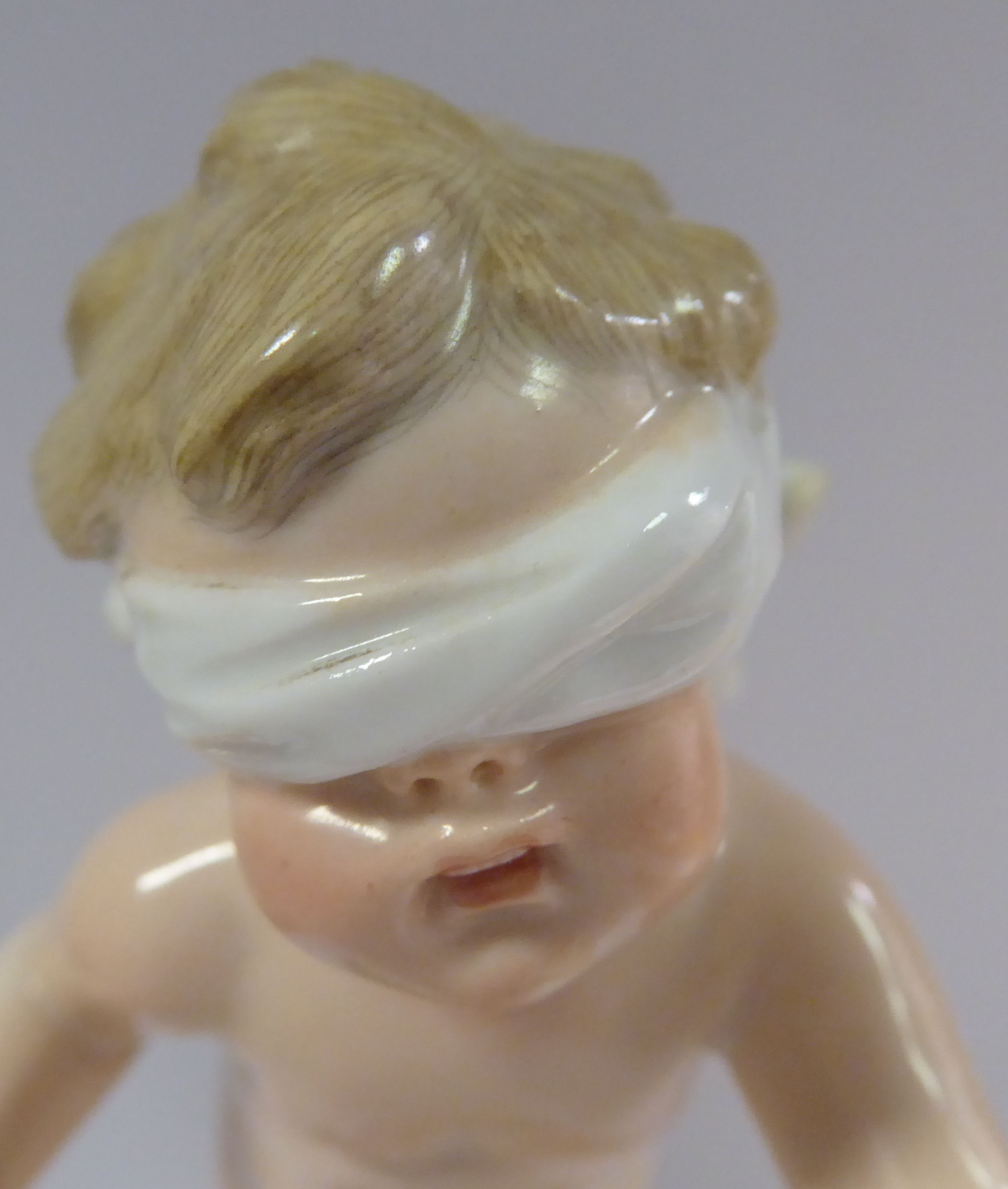 A Meissen porcelain figure 'Cupid Blindfolded' on a gilded, - Image 5 of 6