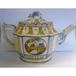 An early 19thC Prattware oval teapot with a lid and dolphin finial,