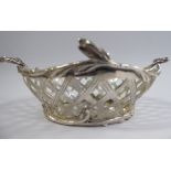 A 20thC Netherlands silver coloured metal oval sweet basket with latticed and foliate ornament