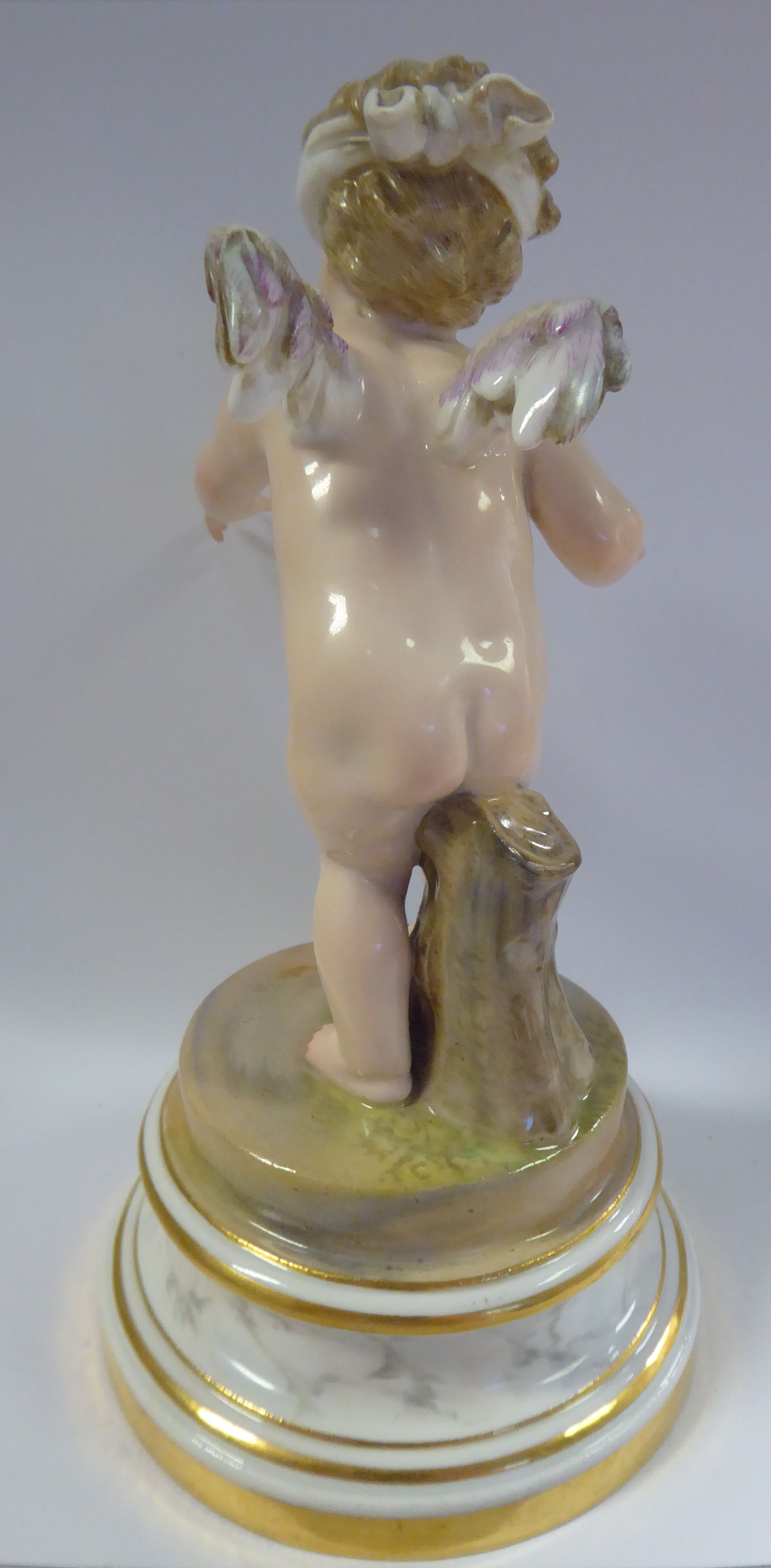 A Meissen porcelain figure 'Cupid Blindfolded' on a gilded, - Image 3 of 6