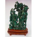 A 20thC Chinese carved malachite group, two women with fish and nets,