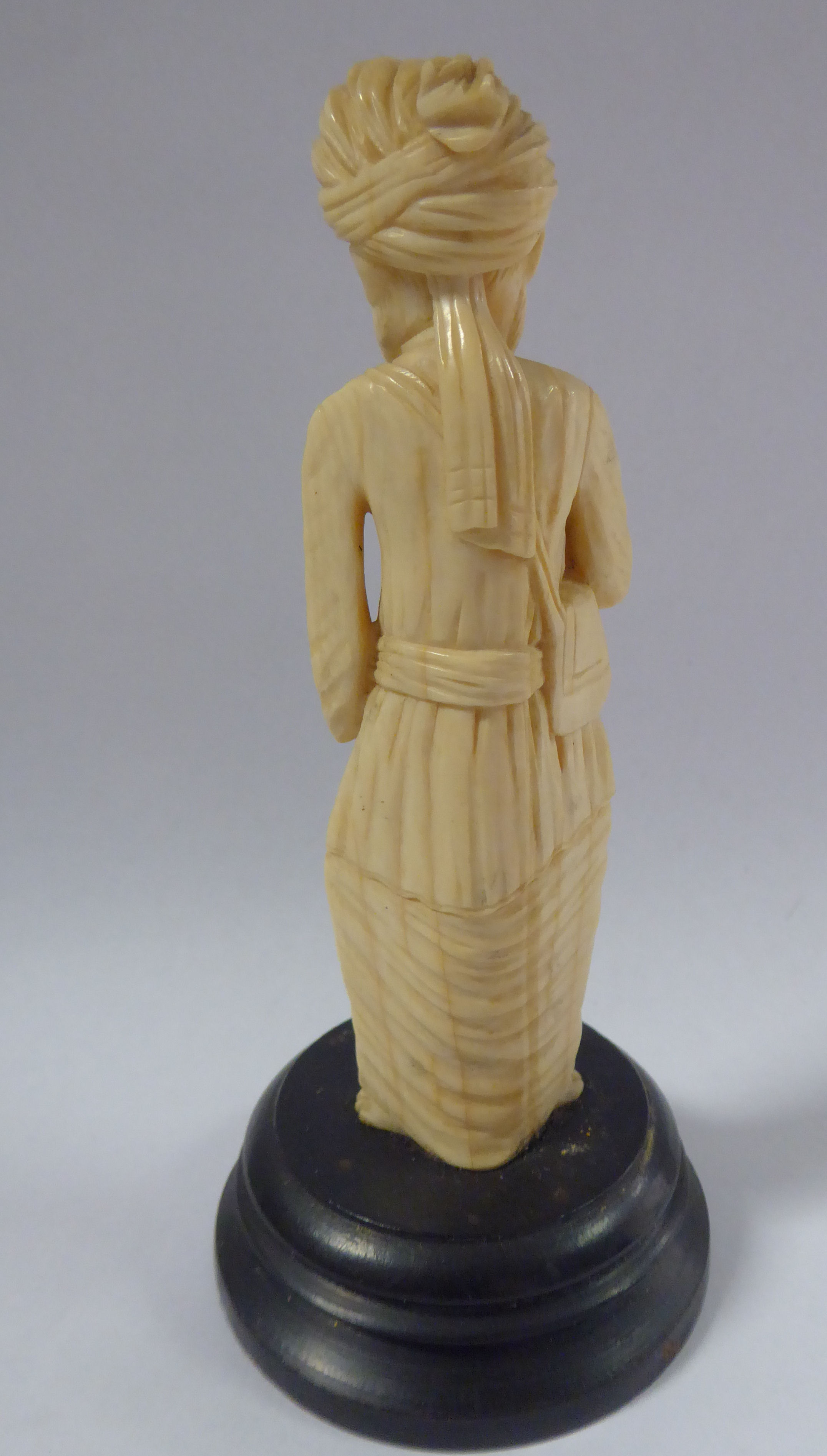 An early 20thC Asian carved ivory standing figure, a bearded man, wearing a turban and robes, - Image 3 of 6