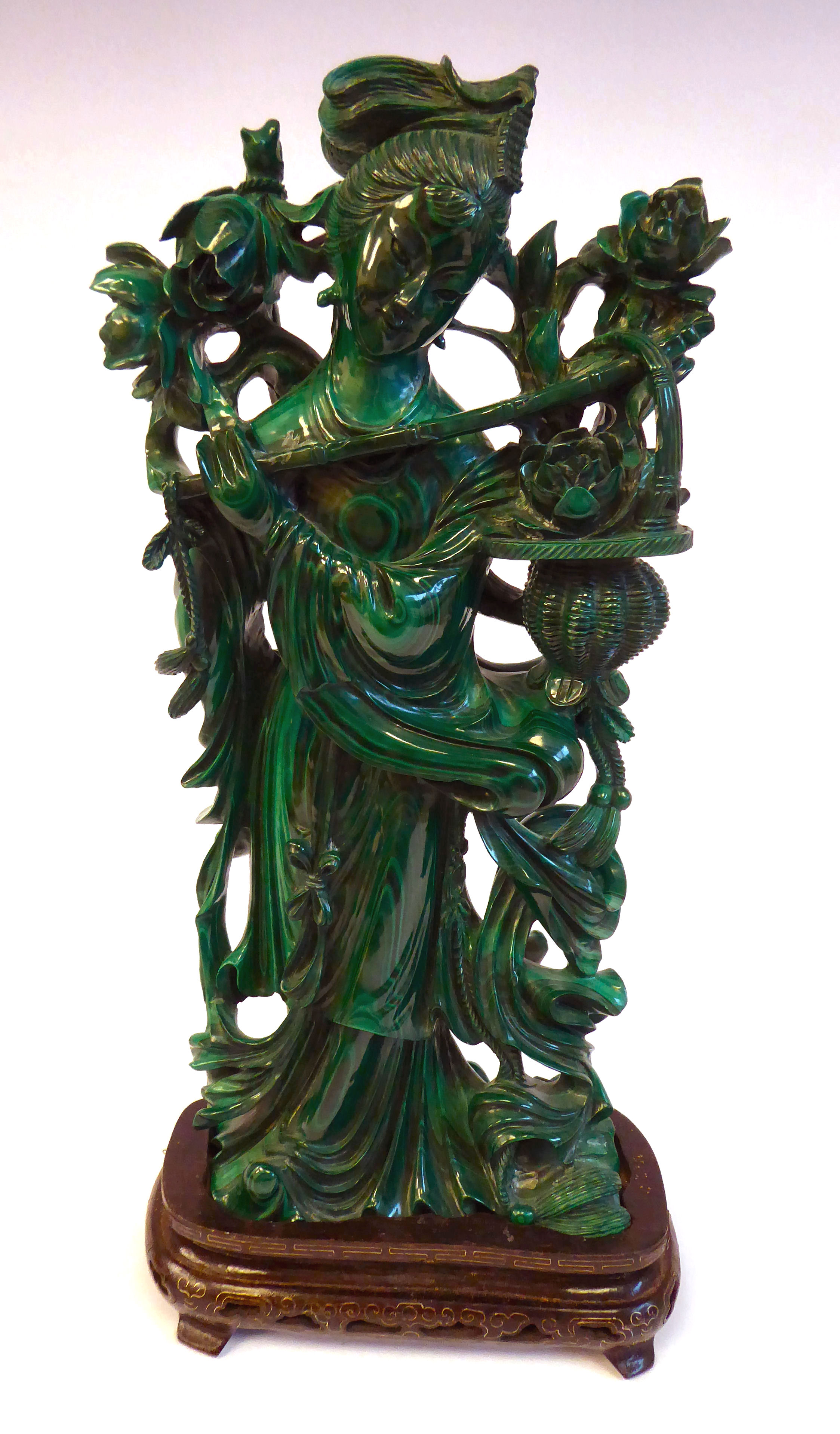 A 20thC Chinese carved malachite figure, a woman with flowers on a branch and in a basket,