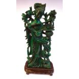 A 20thC Chinese carved malachite figure, a woman with flowers on a branch and in a basket,